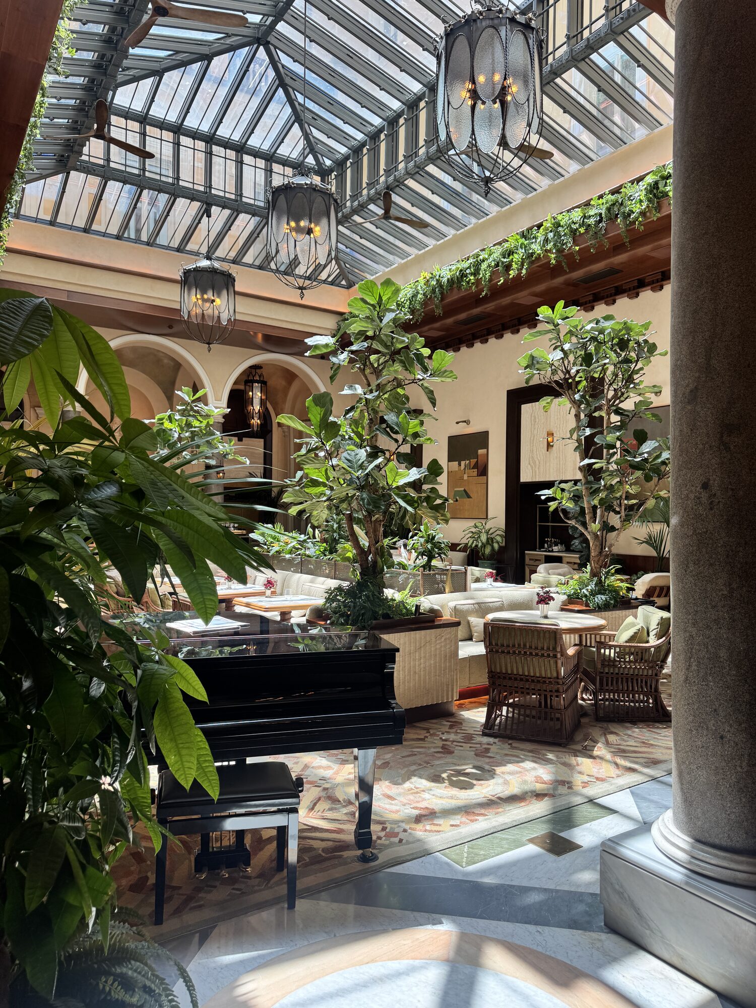 The glass-ceilinged winter garden at Orient Express La Minerva, Rome