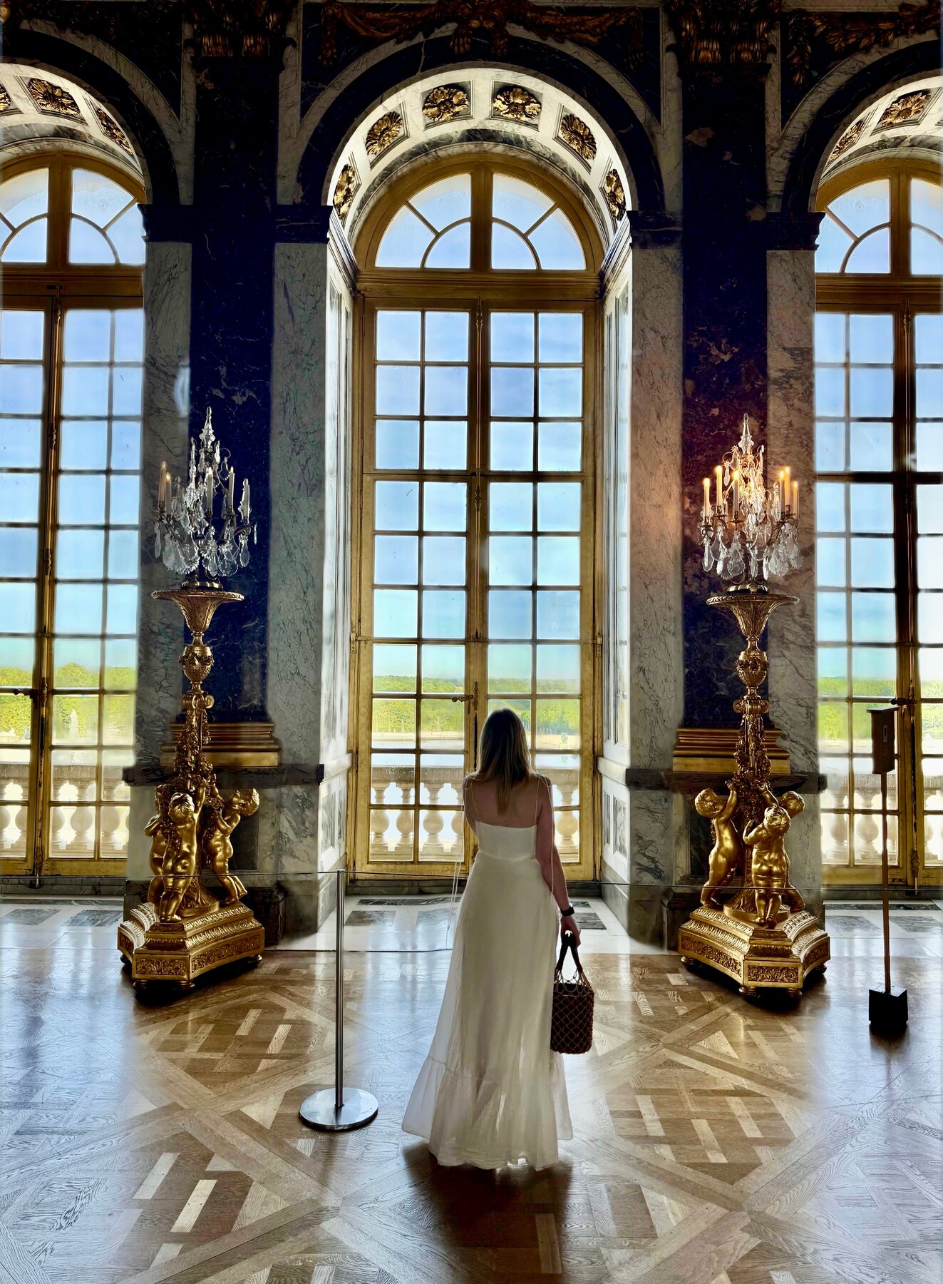 The palace at her back, Versailles