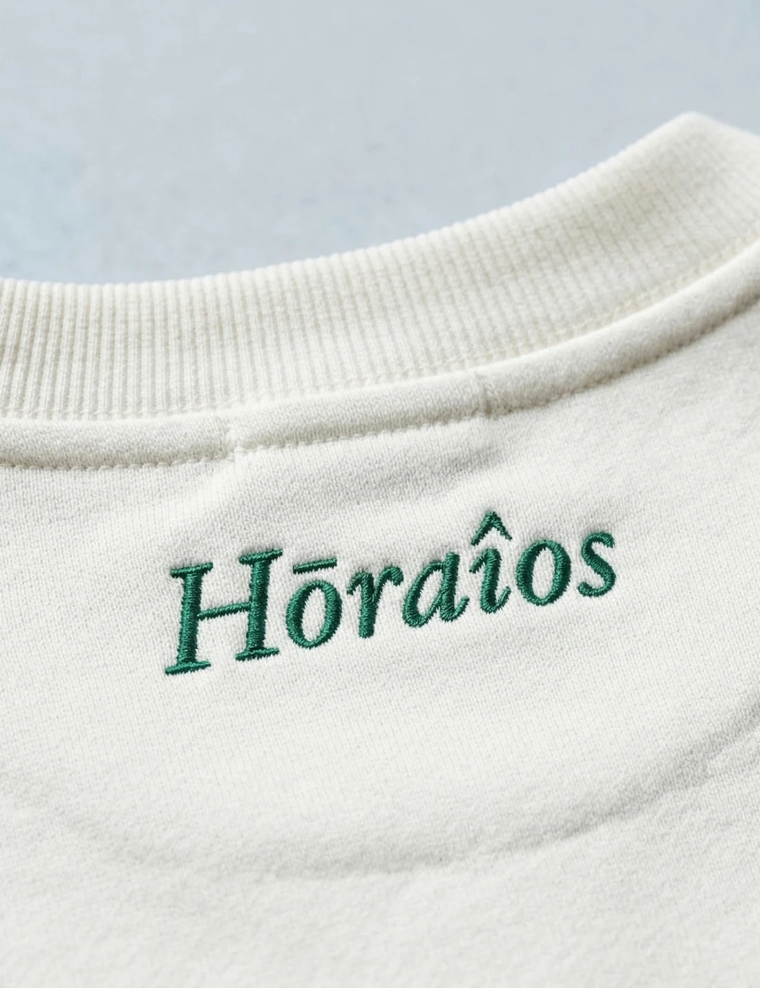 Hōraîos embroidered at the back of the neck