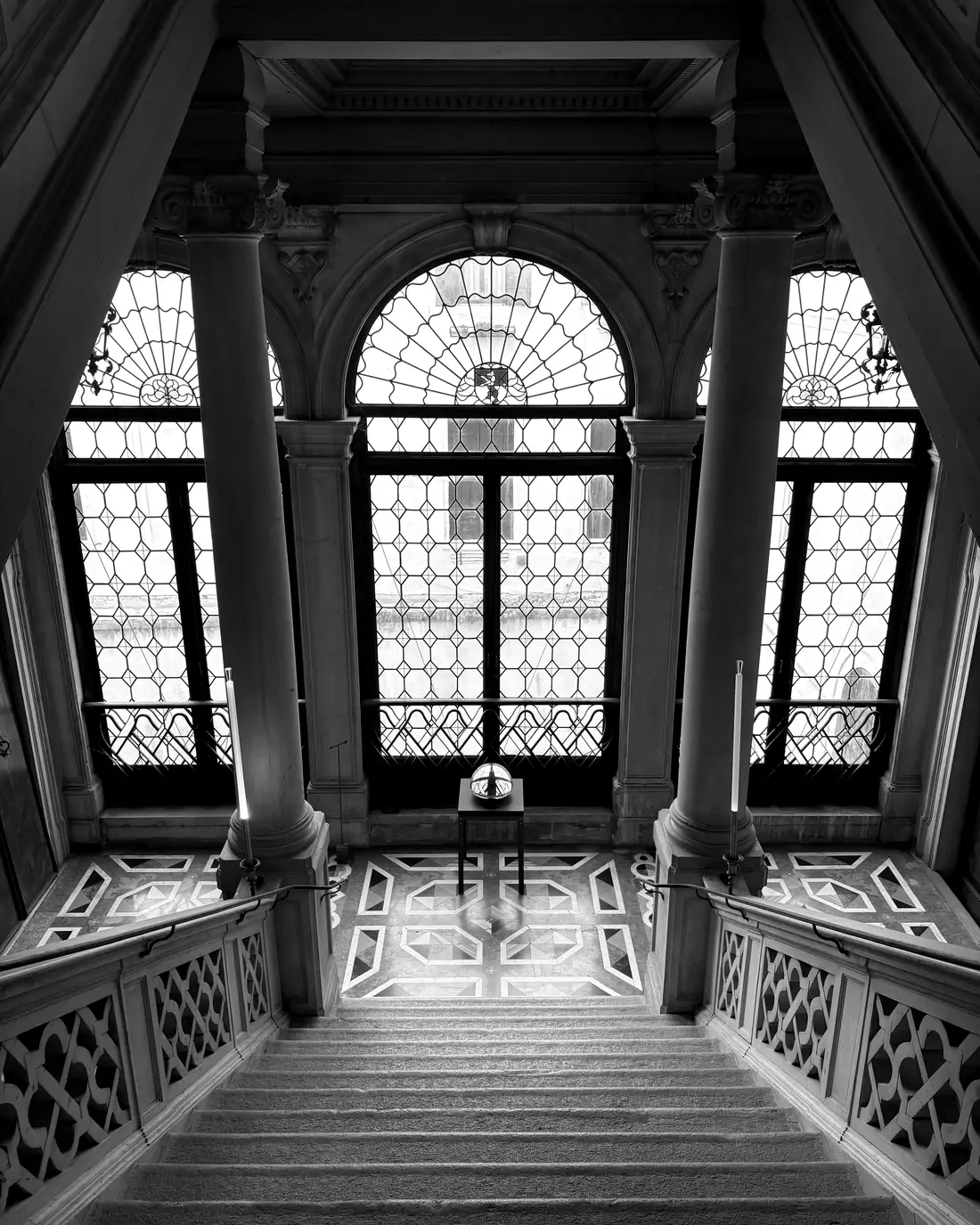 A Venetian palazzo interior, gothic windows and staircase